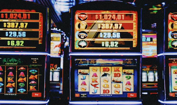 Colorful slot machine reels spinning with animated symbols and glowing lights.